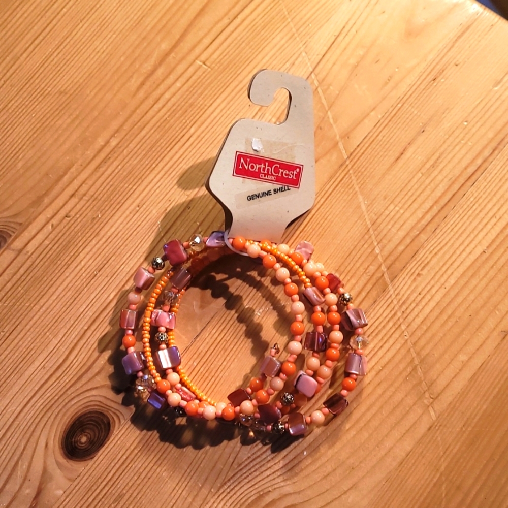 Pink bead and shell spiral bracelet